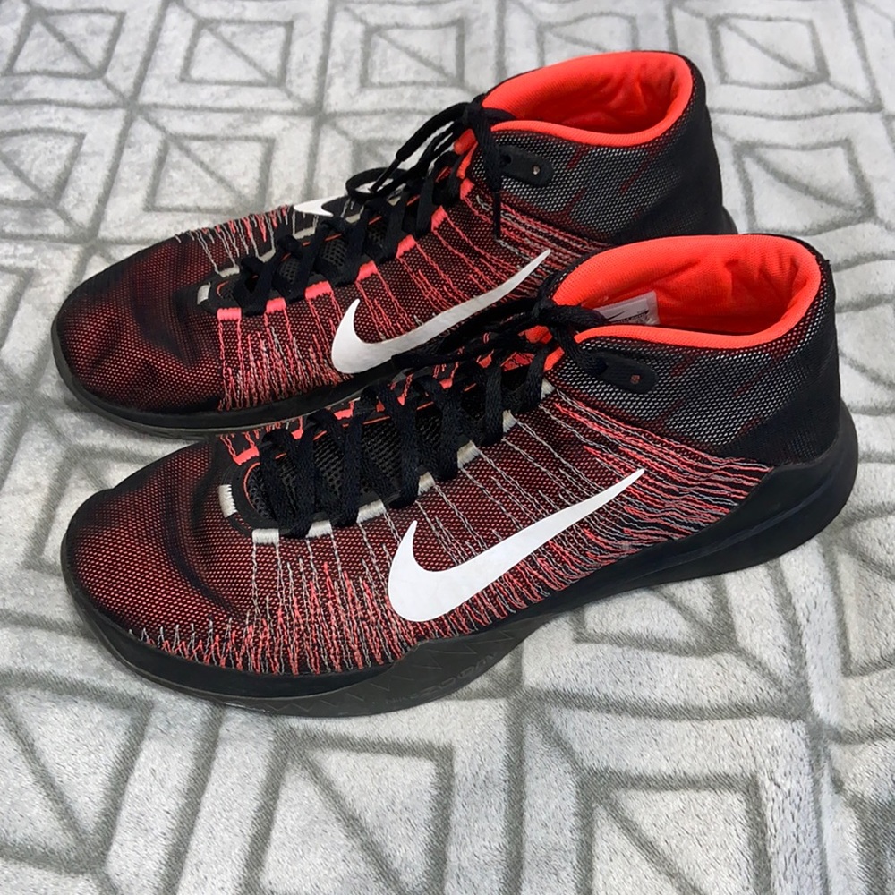 Red and black Nikes shoes